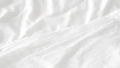 Smooth white bedsheet background, soft texture, clean and minimalist style. Stock Photos