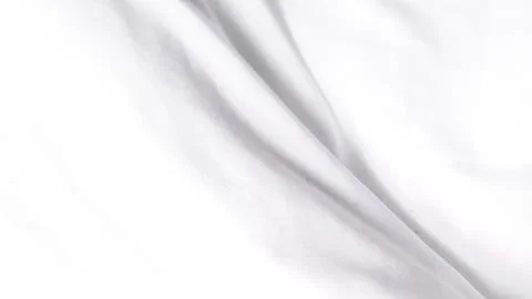 Smooth white fabric texture with soft folds and gentle shadows Stockfoto's
