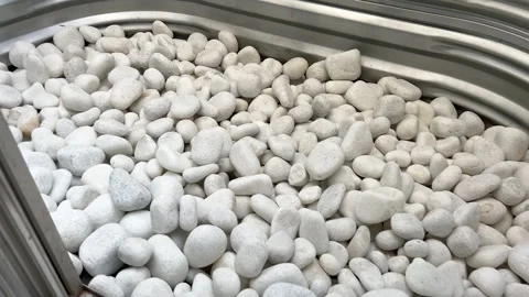 Smooth White Stones in Curved Window Well Stock Footage 324911432