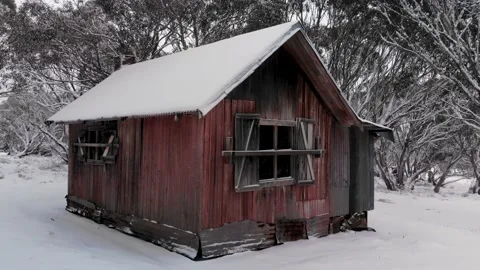 Smooth Zoom Back From Snow Covered High Country Alpine Hut Low Aerial 4K Stock Footage 137615651