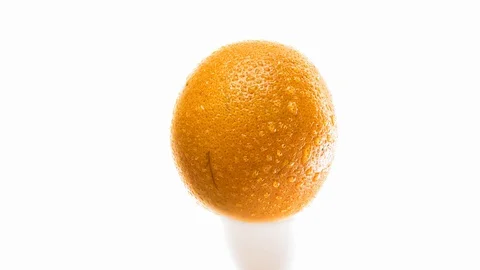 Smooth zoom. Drops of water fall from a juicy citrus peel. UHD 4K footage  Stock Footage 115101034