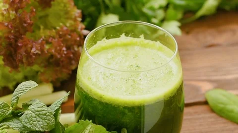 Smoothie from arugula, lollo rossa, spinach, lettuce and mint Stock Footage 72979239