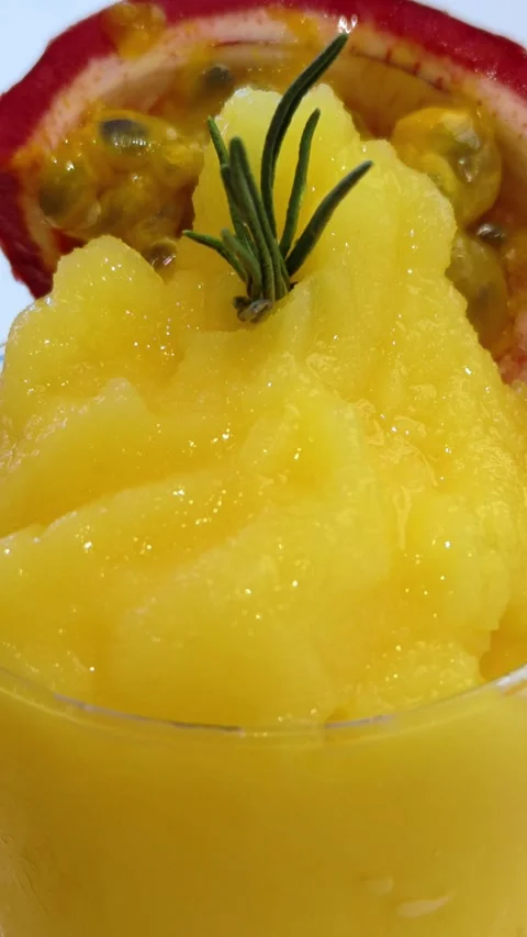 Smoothie mango passion fruit in a glass, fresh mango and passion fruit close-up. Stock Footage 301160093