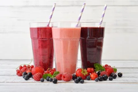 Smoothies with different berries Stock Photos