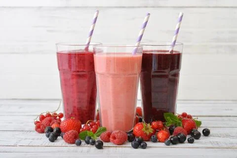Smoothies with different berries Stock Photos