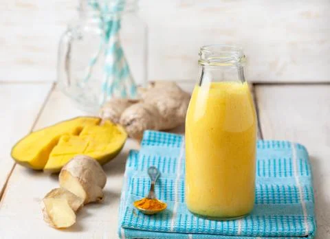 Smoothies with mango, ginger Stock Photos