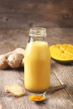 Smoothies with mango, ginger Stock Photos