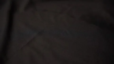 Smoothing black fabric with a steamer. slow motion. Stock Footage 297783000