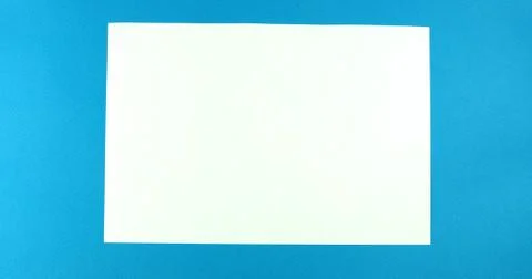 Smoothing a blank sheet on a colored background Stock Photos