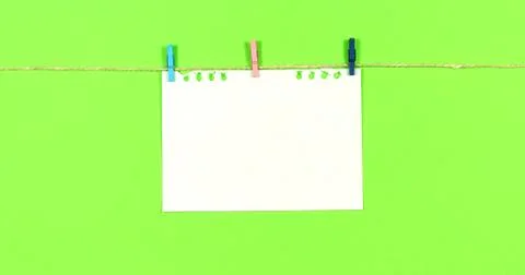 Smoothing a blank sheet on a colored background. Stock Photos