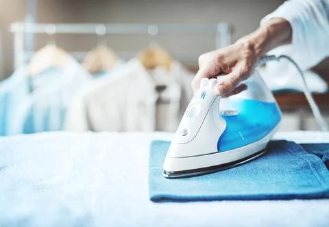 Smoothing out all the creases. Closeup shot of an unidentifiable woman ironing Stock Photos
