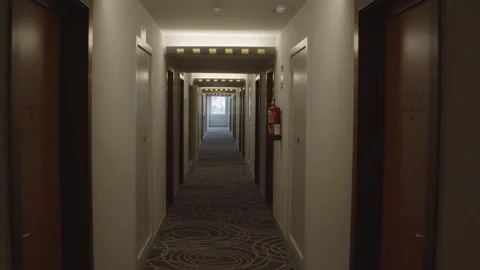 Smoothly gliding camera journey through a hotel corridor 動画素材 300650589