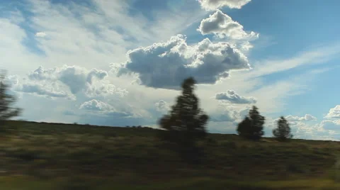 Smoothly sliding passing captivating clouds and countryside Stock Footage 61685722