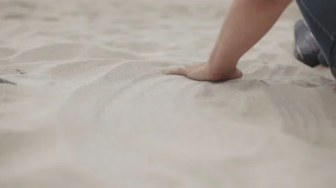 Smooting sand by hand Stock Footage 61934436
