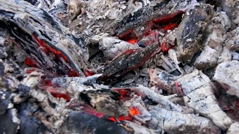Smouldering embers of a campfire close-up . Stock Footage 146936697