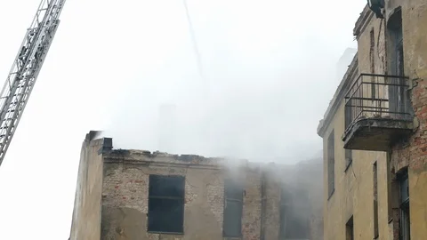 Smouldering structural fire on abandoned building Stock-Footage 99509737