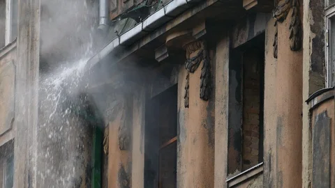 Smouldering structural fire on abandoned building 스톡 동영상 100035824