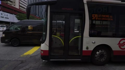 SMRT bus making a left turn at Chinatown Stock Footage 137174845