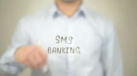 SMS Banking,  Man writing on transparent screen Stock Footage 62978099