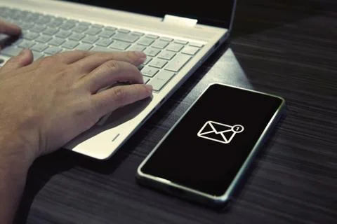 SMS password for network access on phone while typing on laptop. Generic icon 写真素材