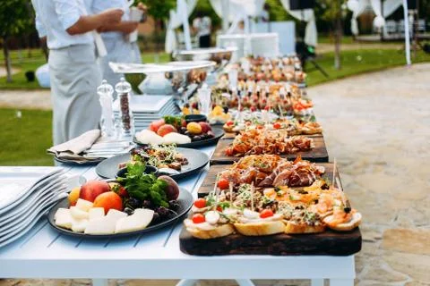 Snack and fruit table for an open-air party.. Stock Photos