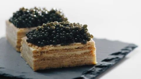 Snack Appetizer with Black Caviar Bread and Butter Stock Footage 107445562