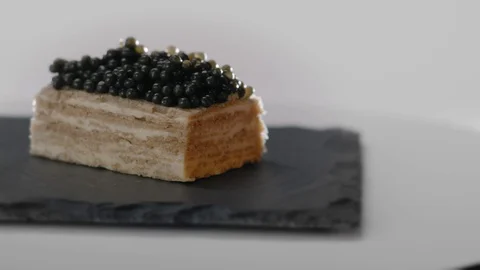 Snack Appetizer with Black Caviar Bread and Butter rotation food Video stock 107445793