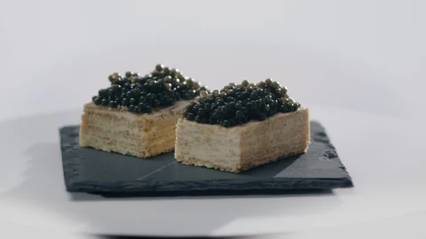 Snack Appetizer with Black Caviar rotation food Stock Footage 107445489