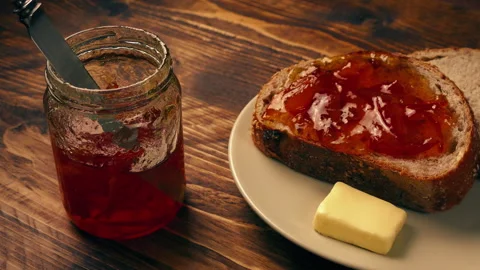 Snack Of Bread And Marmalade With Butter Stock Footage 262189743