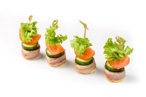 Snack canapes to the buffet on a white background Stock Photos