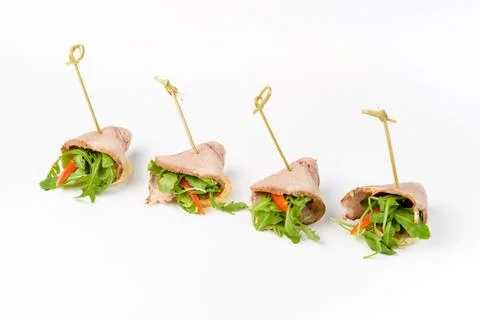 Snack canapes to the buffet on a white background Foto stock