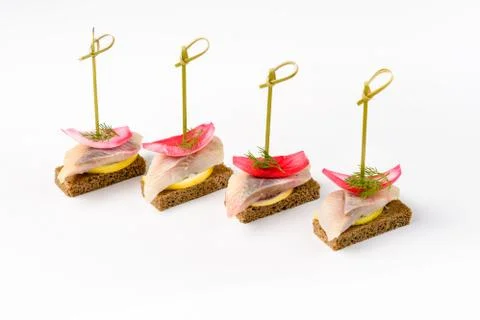 Snack canapes to the buffet on a white background Foto stock