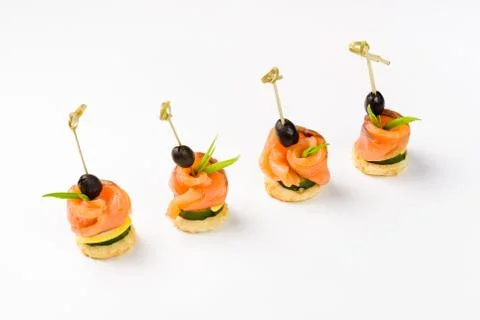 Snack canapes to the buffet on a white background Foto stock