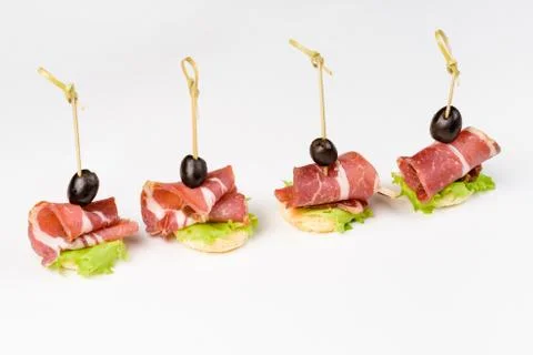 Snack canapes to the buffet on a white background Foto stock