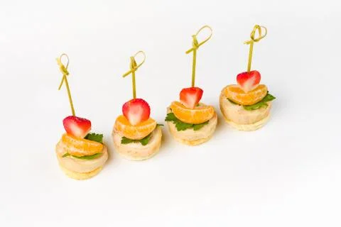 Snack canapes to the buffet on a white background Foto stock