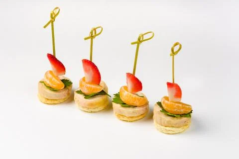 Snack canapes to the buffet on a white background Foto stock