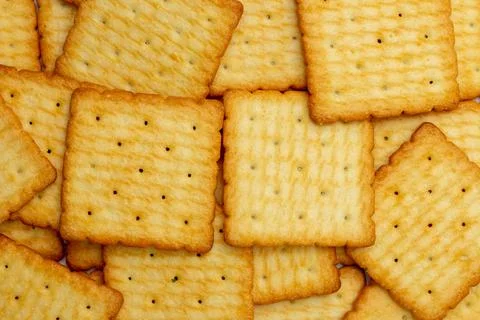 Snack concept, Stacking of salty crackers or biscuits as a background Stock Photos