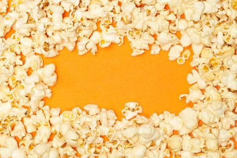 Snack concept, Sweet popcorn with empty space in circle shape of orange backg Stock Photos
