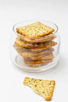 Snack concept, Vegetable crackers or biscuits in a glass jar with cracker scr Stock Photos