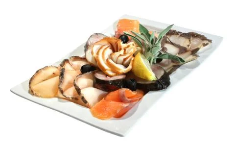 Snack of different fish varieties - combination of smoked salmon, sturgeon, h Stock Photos