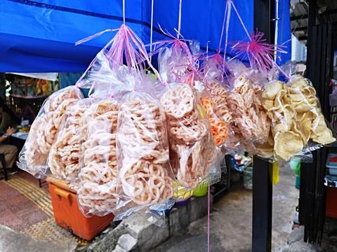 Snack fried crackers in plastic packaging Stock Photos