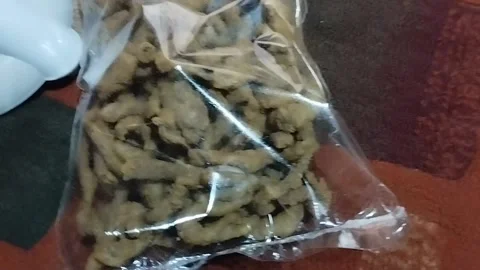 This is a snack of intestinal chips that have been wrapped in clear plastic Stock Footage 221523212