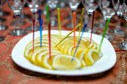 A snack of lemon stands on a buffet table 写真素材