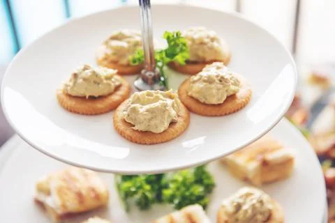Snack refreshment crackers on white dishes Stock Photos