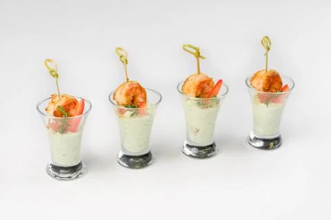 Snack shrimp with sauce in a glass stack on a white background Stock Photos