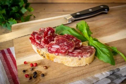 Snack, slice of bread with salami sliced Stock Photos