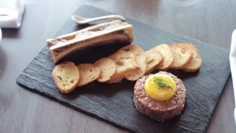 Snack tray with crackers and meat and bone marrow Stock Footage 307340125