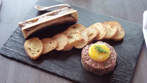 Snack tray with crackers and meat and bone marrow Stock Footage 307340127