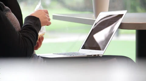 Snacking while working on Computer Stock Footage 36174057