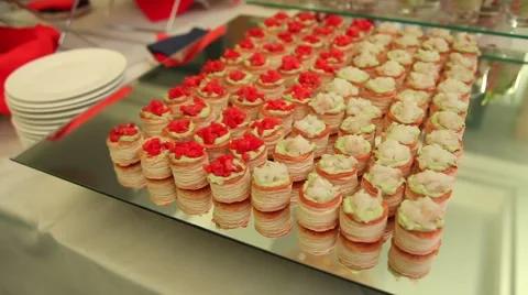 Snacks and desserts are on the table in the plates and glasses Stock Footage 52816203